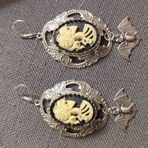 female skeleton earrings with bats